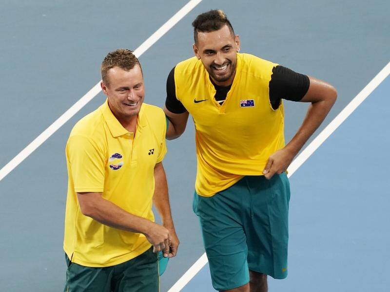 Lleyton Hewitt (L) says he'd love to join forces again with Nick Kyrgios (R) in th national team.