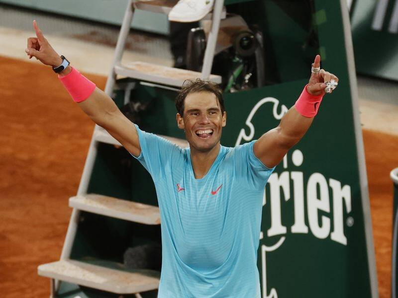 He's done it again! Rafael Nadal celebrates after winning his 13th French Open title.