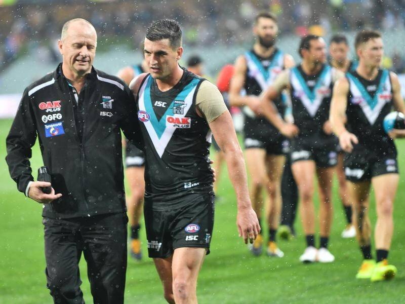 Port Adelaide coach Ken Hinkley (l) discusses the 89-51 win over Gold Coast with with Tom Rockliff.