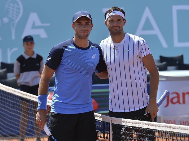 Borna Coric (l) and Grigor Dimitrov (r) have tested positive for COVID-19 after playing in Croatia.
