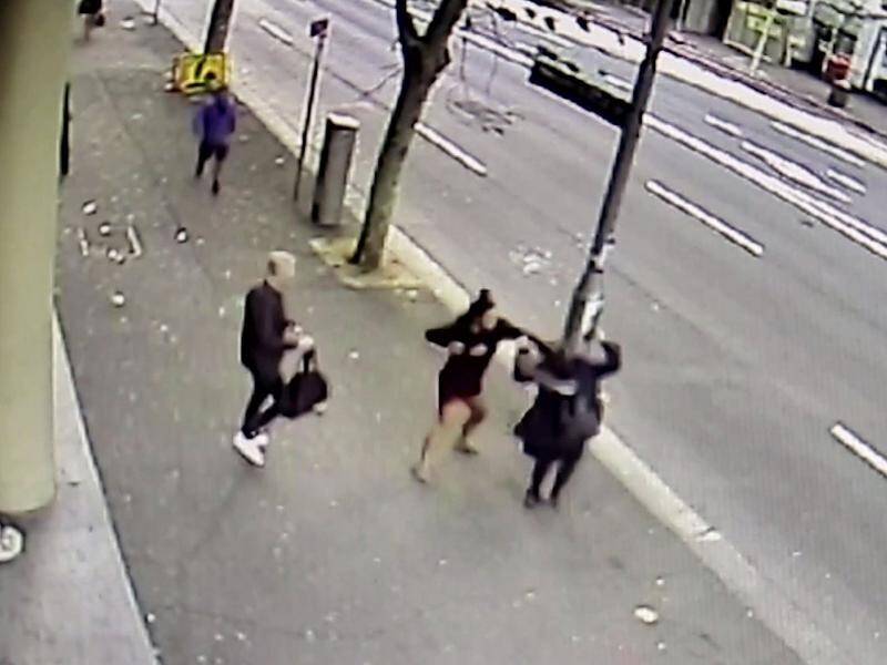 A London man is being hailed a hero after defending a pregnant woman attacked on a Sydney street.