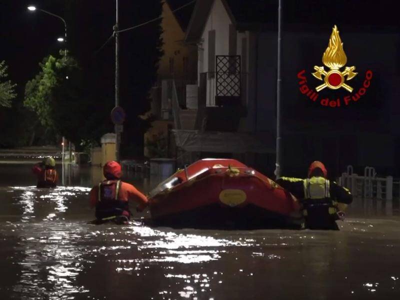 Firefighters on a rescue mission after flooding in Senigallia, Ancona province, central Italy. (EPA PHOTO)