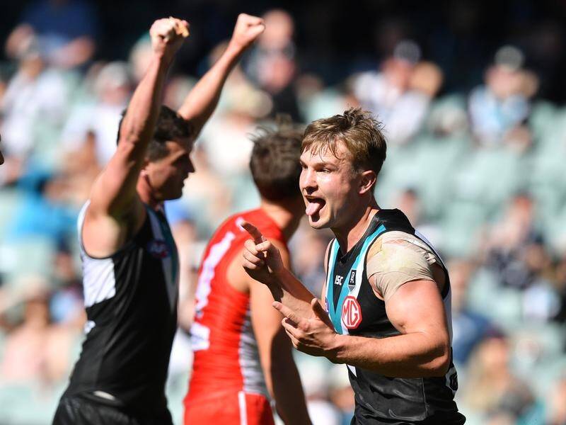 Ollie Wines committed his future to Port Adelaide until at least the end of the 2026 AFL season.