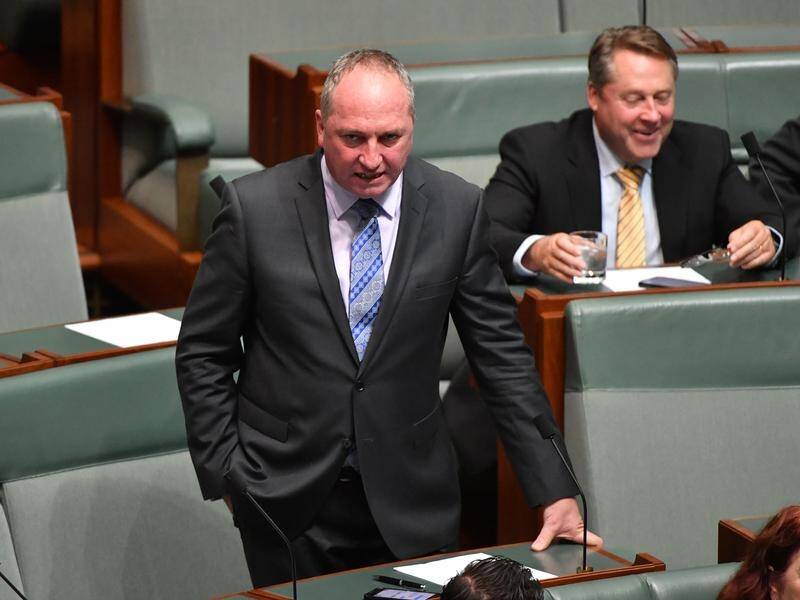 Government backbencher Barnaby Joyce has warned rebel Nationals MP could cross the floor.
