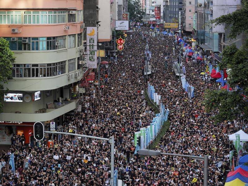 Protesters flood the streets as they take part in an anti-government rally in Hong Kong.