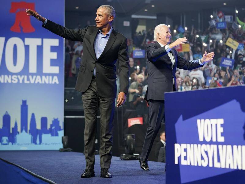 Barack Obama (left) and Joe Biden are trying to boost support for the Democrats. (AP PHOTO)