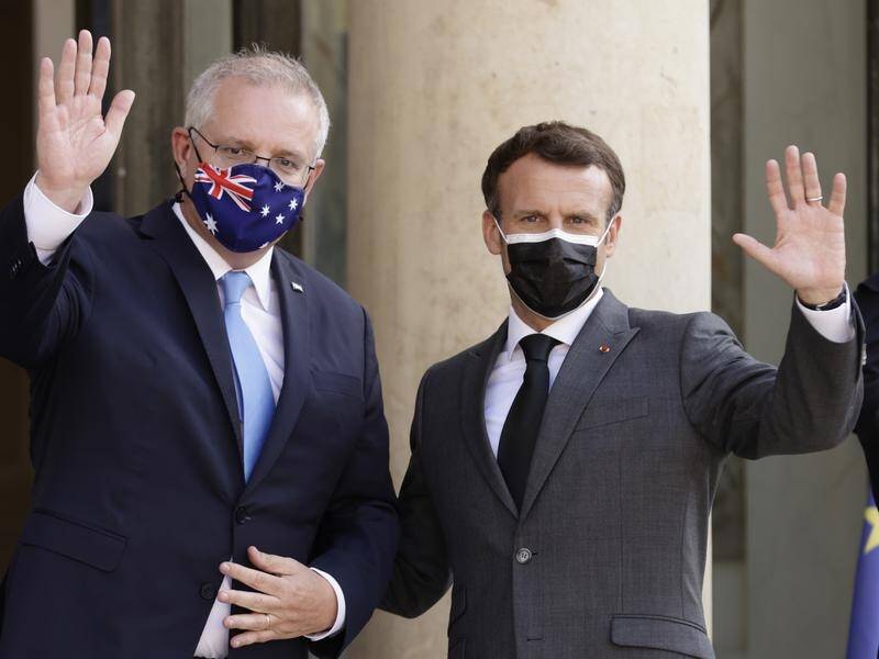 Scott Morrison has rejected claims by Emmanuel Macron (r) he "lied" about a submarine contract.