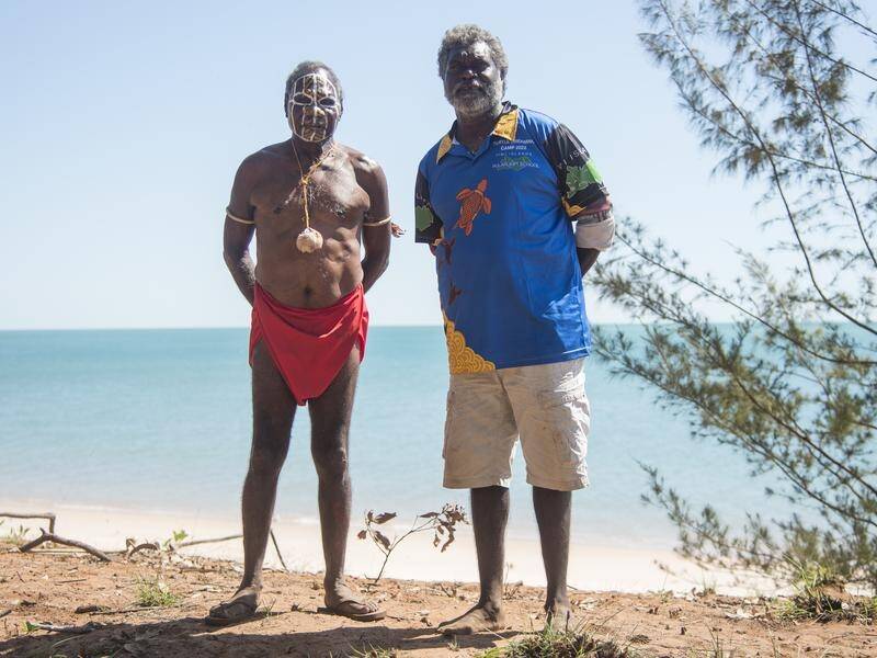 Dennis Tipakalippa (right) is fighting a regulator's decision to allow Santos to drill eight wells. (Aaron Bunch/AAP PHOTOS)