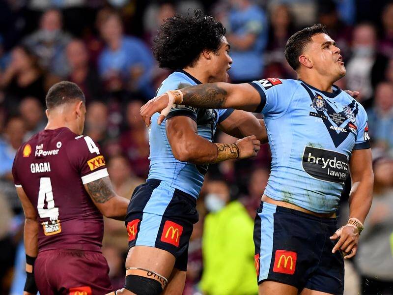 Latrell Mitchell (right) had an exceptional first half, helping to set up NSW's Origin win.