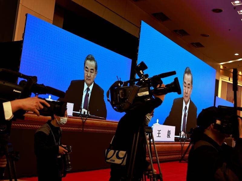China's foreign minister warned the US to roll back the 