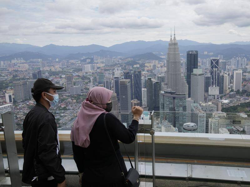 Authorities say fully vaccinated locals are able to travel to other Malaysian states for holidays.