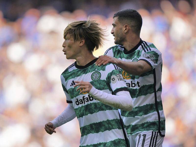 Celtic's Kyogo Furuhashi (left) celebrates scoring the winner against Old Firm rivals Rangers. (AP PHOTO)