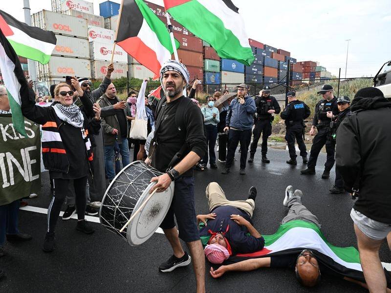 Trade Unionists for Palestine supporters have disrupted cargo trucks at a protest in Melbourne. (James Ross/AAP PHOTOS)