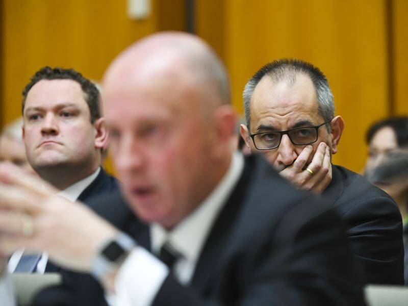 Mike Pezzullo(R) called AFP Deputy Comm Neil Gaughan(C)after a raid on a NewsCorp journalist's house