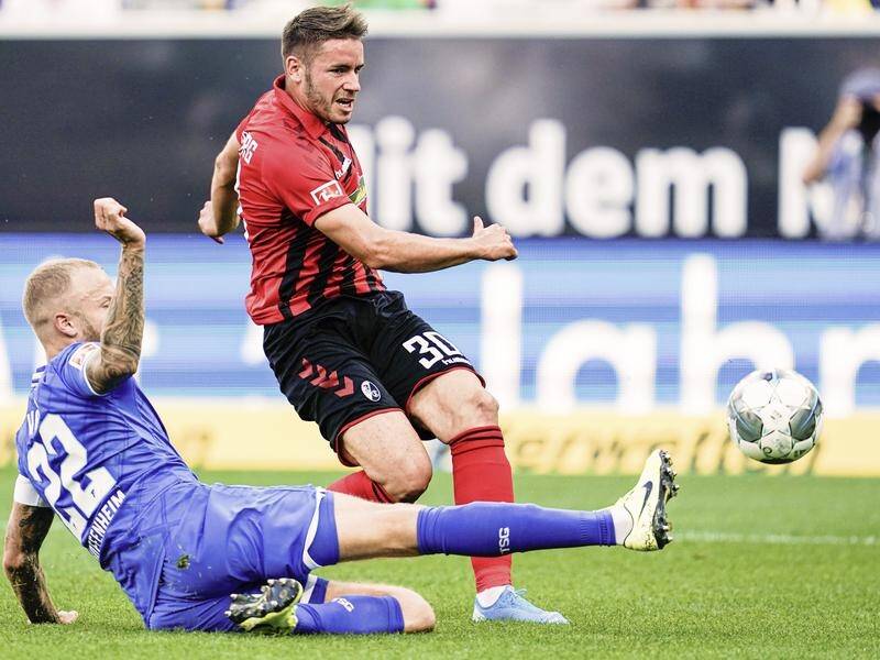 Christian Guenter (R) has helped Freiburg to a 3-0 win over Hoffenheim in the German Bundesliga.