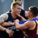 Carlton's Patrick Cripps tangles with Dayne Zorko in the Blues' at-times heated loss to Brisbane. (Jono Searle/AAP PHOTOS)