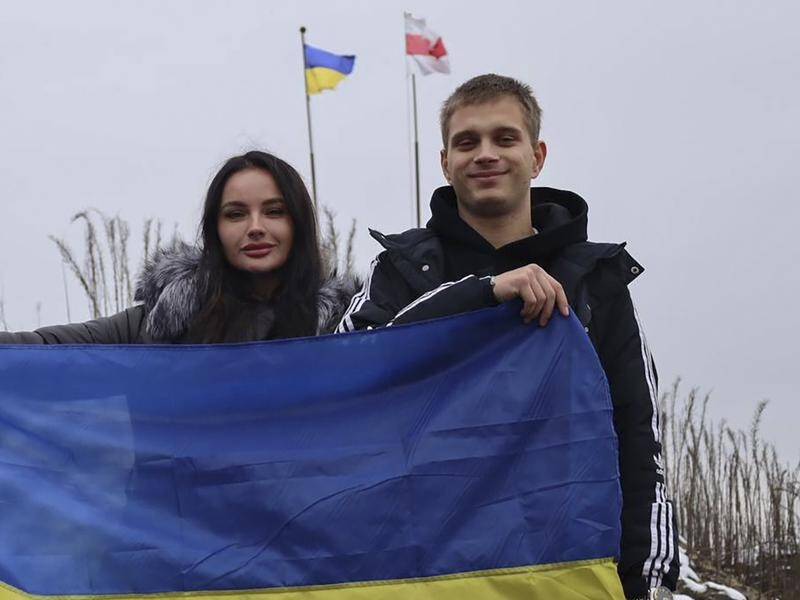 Teenager Bohdan Yermokhin, right, has been returned to Ukraine after being takne to Russia. (AP PHOTO)