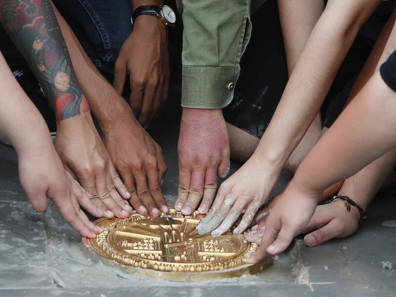 An anti-monarchy plaque installed by activists near the Grand Palace in Bangkok has disappeared.