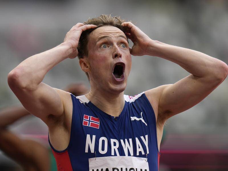 Norway's Karsten Warholm has won the Olympic men's 400-metres hurdles final in world record time.