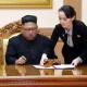 Kim Yo-jong (r) has called South Korea's president "childish" over his offer of economic aid. (AP PHOTO)