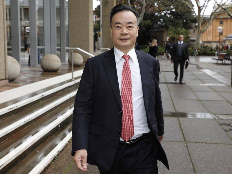 Chau Chak Wing leaves Sydney's Federal Court in 2018 after suing media outlets for defamation.