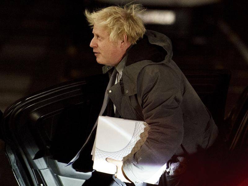 Former UK prime minister Boris Johnson has avoided the public, arriving early at a COVID-19 inquiry. (AP PHOTO)