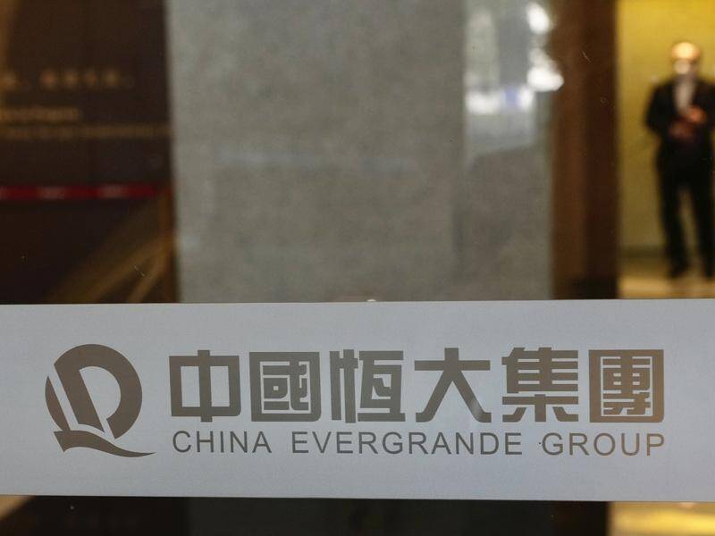 Holders of a dollar bond guaranteed by China Evergrande Group have yet to be paid.