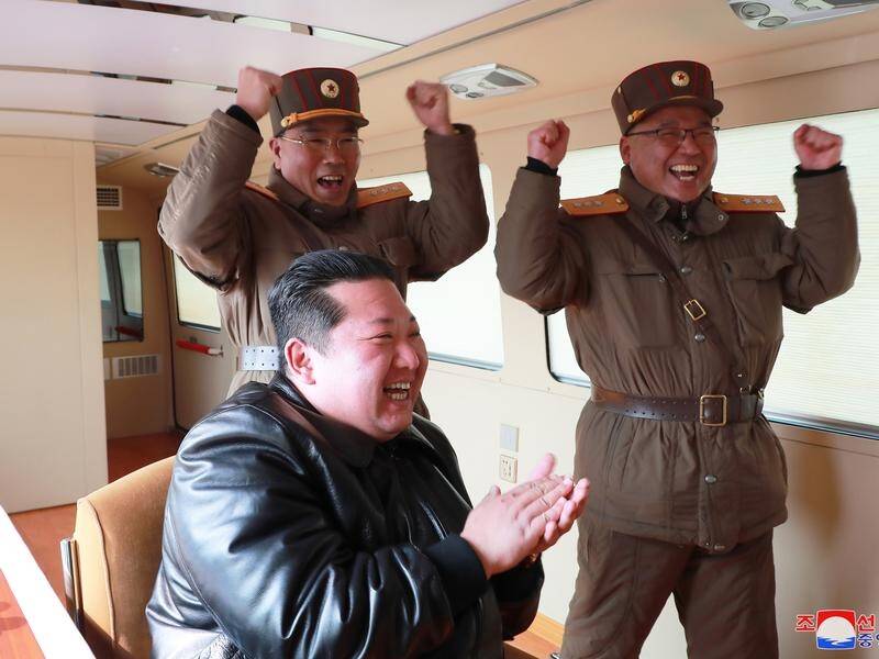 North Korean leader Kim Jong-un has been pictured applauding the launch of the ICBM Hwasongpho-17.