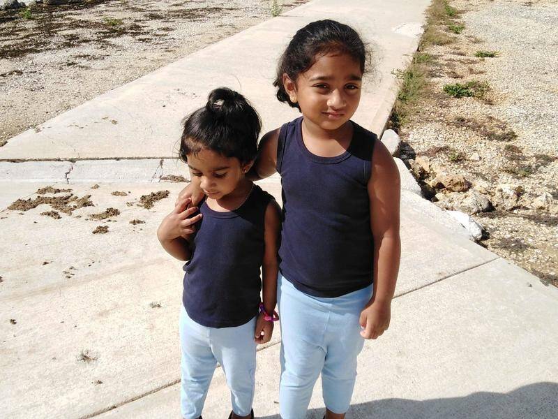 Kopika (right) and Tharnicaa have been detained on Christmas Island since August 2019.