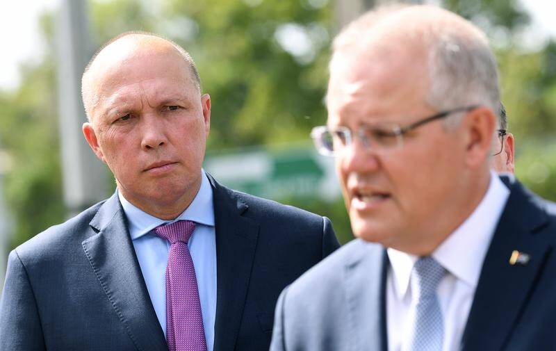 Prime Minister Scott Morrison (right) and Home Affairs Minister Peter Dutton of Queensland's LNP. The Coalition has been hunting for donations to fuel its campaigns in key electorates, including Dutton's. Picture: AAP