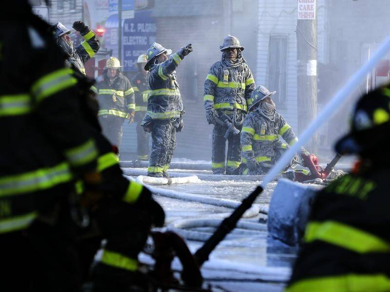 Nine children are among the 19 killed in a large blaze in the Bronx.