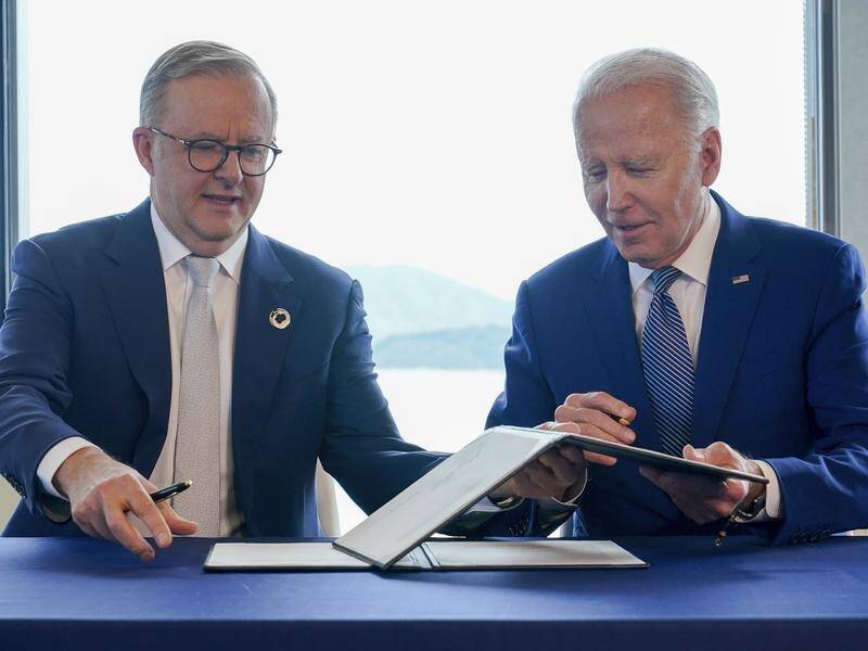 Anthony Albanese and Joe Biden have signed an agreement on climate and clean energy action in Japan. (AP PHOTO)