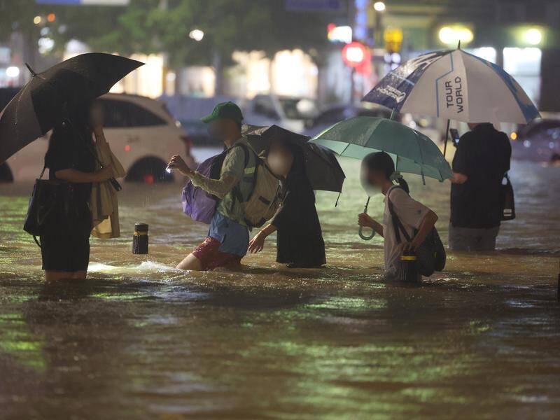 At least eight people are dead after the worst rains in Seoul, South Korea in years. (EPA PHOTO)