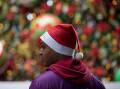 Santa hats and seafood herald Christmas in Australia with weather far from beachy on the east coast. (Brent Lewin/AAP PHOTOS)