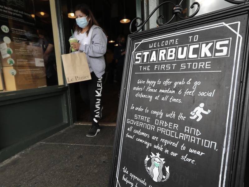 Starbucks says it will require customers to wear masks at all of its cafes in the United States.