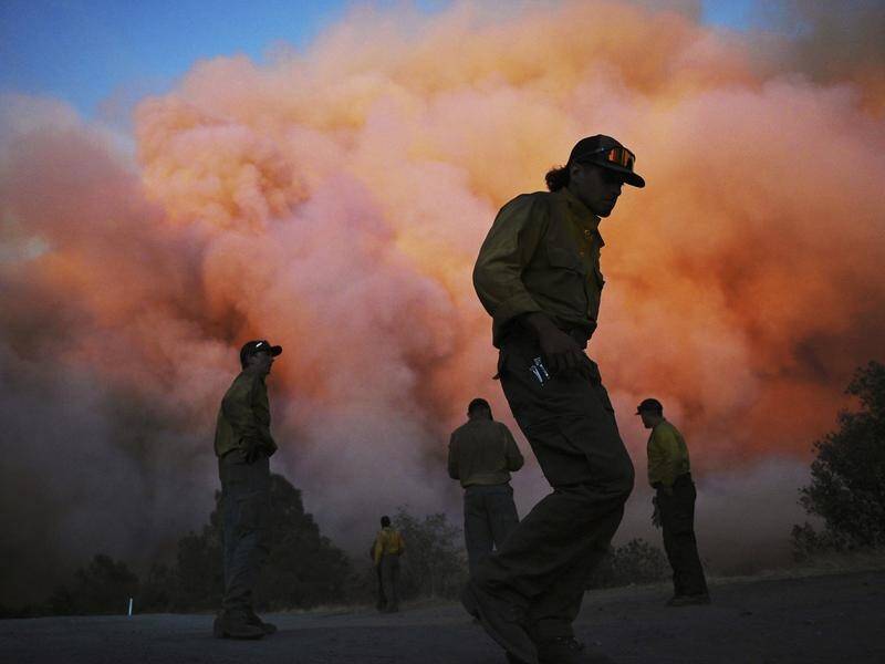 Crews made significant progress against the Oak fire in California, which is over half contained. (AP PHOTO)
