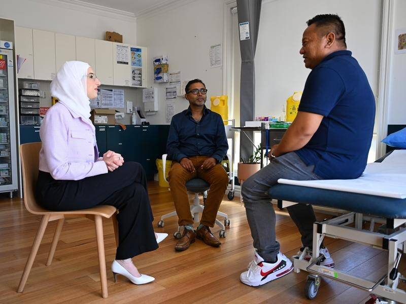 (L-R) Dr Amireh Fakhouri, Dr Lester Mascarenhas and interpreter Francis work in refugee health. (James Ross/AAP PHOTOS)