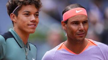 Rafael Nadal (R), who beat 16-year-old Darwin Blanch (L), next faces Australian No.1 Alex de Minaur. (AP PHOTO)