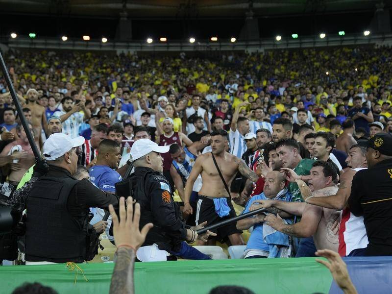 Police had to break up a fight between Brazil and Argentina fans at the Maracana. (AP PHOTO)