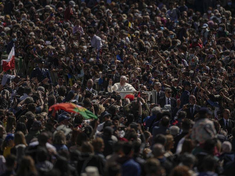 Pope Francis drives through the crowd at the end of the Easter Sunday mass in St Peter's Square.