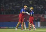 Virat Kohli (R) and Cameron Green touch gloves during their IPL partnership for Bengaluru. (AP PHOTO)