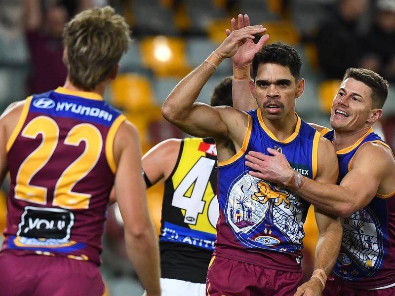 Brisbane's Charlie Cameron (centre) scored five goals as the Lions thrashed Richmond at the Gabba. (Jono Searle/AAP PHOTOS)
