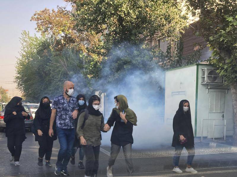 The latest round of clashes between Iranian protesters and security forces has left seven dead. (AP PHOTO)