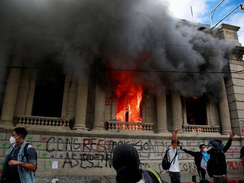 Protesters angry at a new budget have destroyed part of the Congress building Guatemala City.