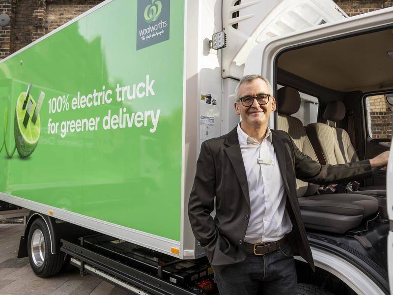 Woolworths chief executive Brad Banducci with an electric delivery truck. (HANDOUT/WOOLWORTHS)
