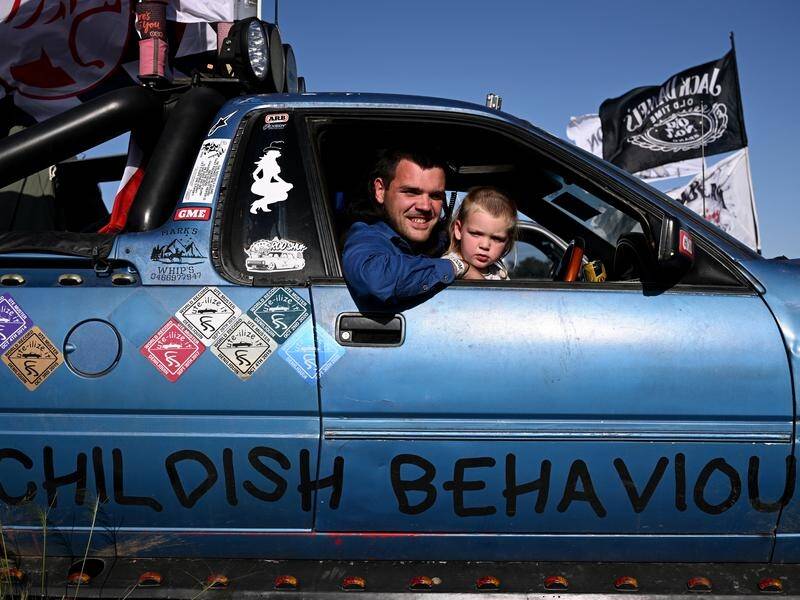 Mark Williscroft has brought his two-year-old son Logan to the annual Deniliquin Ute Muster in NSW. (Joel Carrett/AAP PHOTOS)