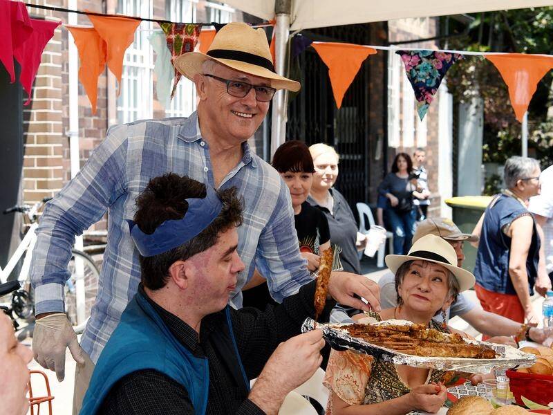 Former PM Malcolm Turnbull helped serve lunch at Wayside Chapel's Christmas lunch in Sydney.