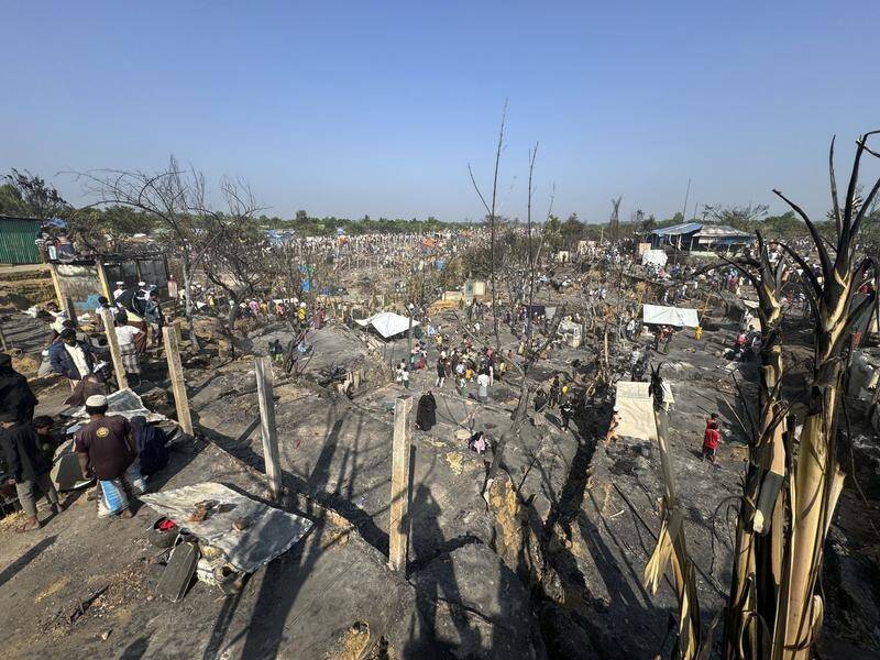 Bangladeshi officials say people in a refugee camp have been given temporary shelters after a fire. (AP PHOTO)
