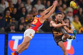 Hawthorn's Jack Gunston (right) was a constant threat against his former side, kicking four goals. (Morgan Hancock/AAP PHOTOS)