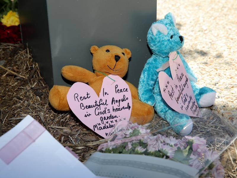 Flowers, cards and teddy bears have been left outside the Djurasovic family's home in Perth.